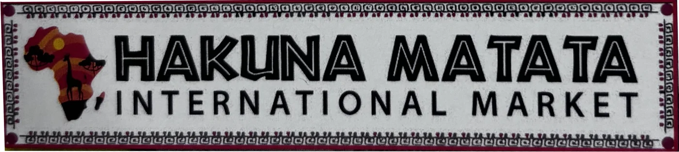The Hakuna Matata International Market storefront sign, showing the market's name beside a map of Africa filled with a sunset, acacia trees, and a giraffe.